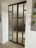 Fourniture et pose d'une porte vitrée coulissante